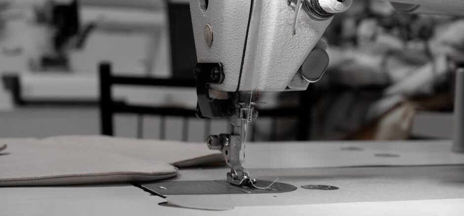 bernina - Closeup of an industrial sewing machine in a textile factory, focused on needle and fabric